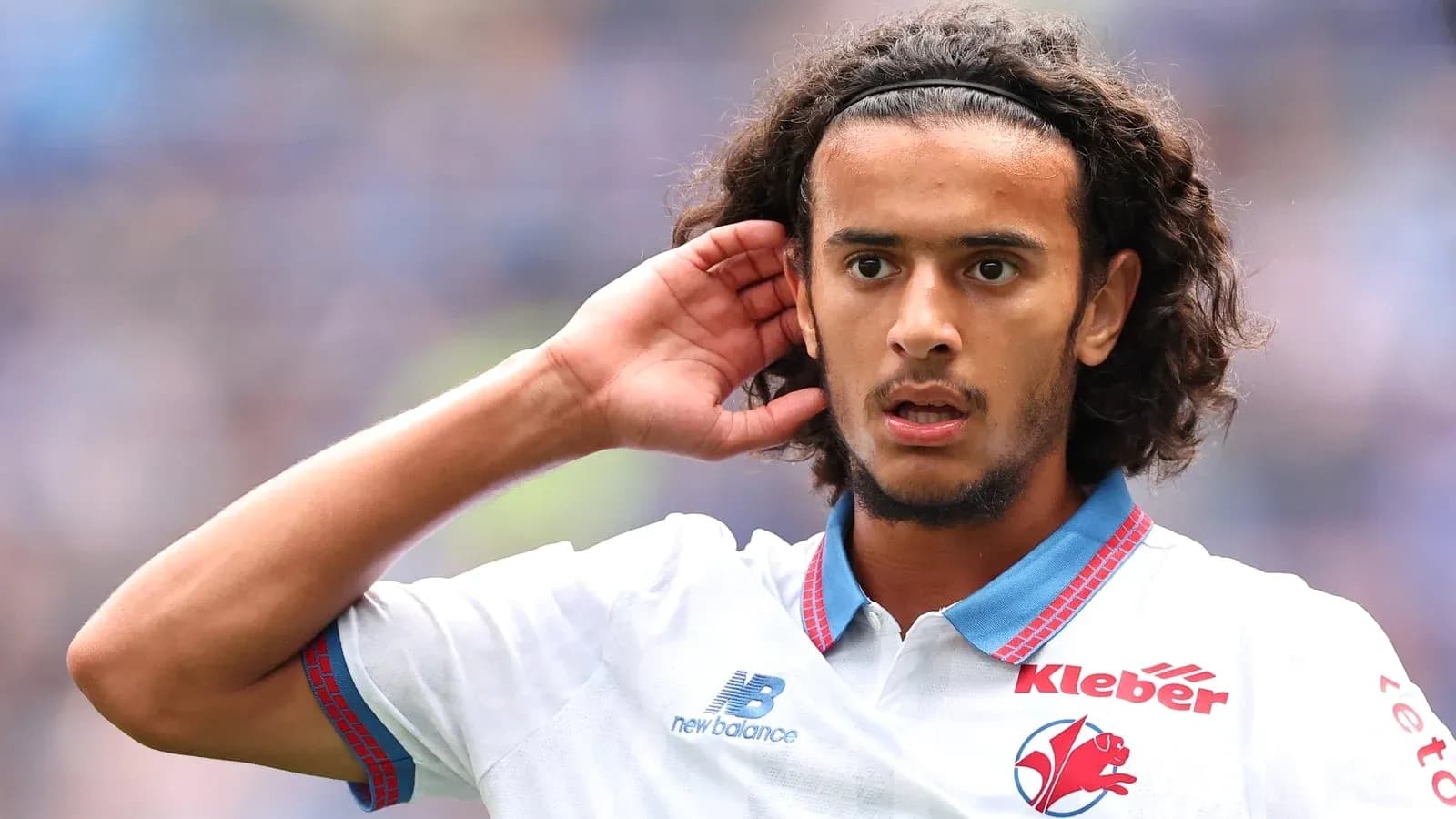 Player gesturing during a match on the field Player gesturing during a match on the field