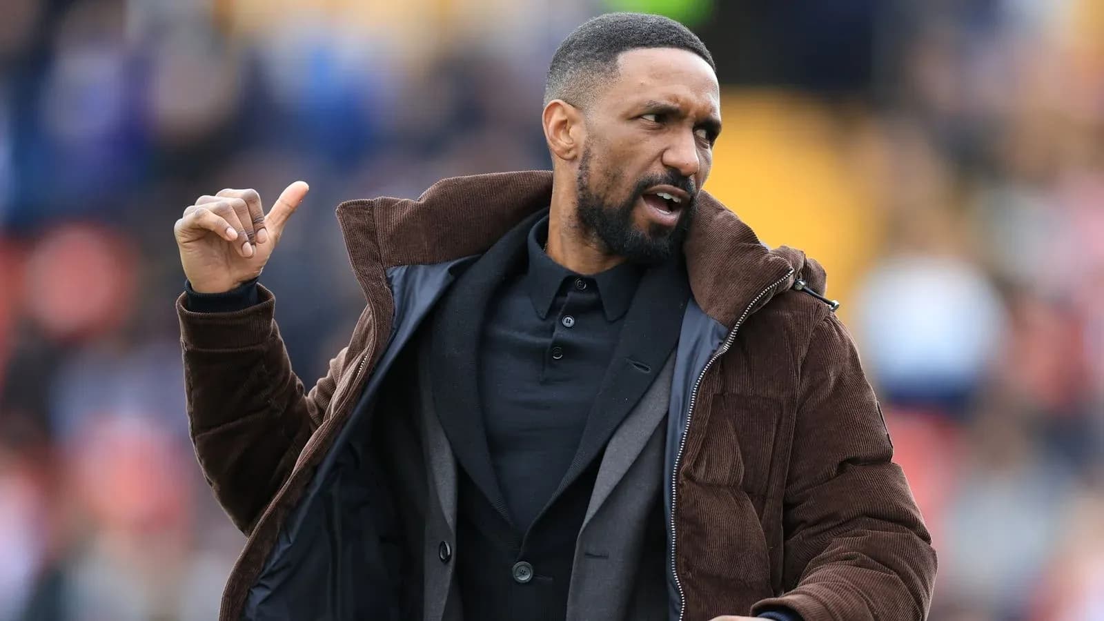 Coach gesturing during a football match Coach gesturing during a football match