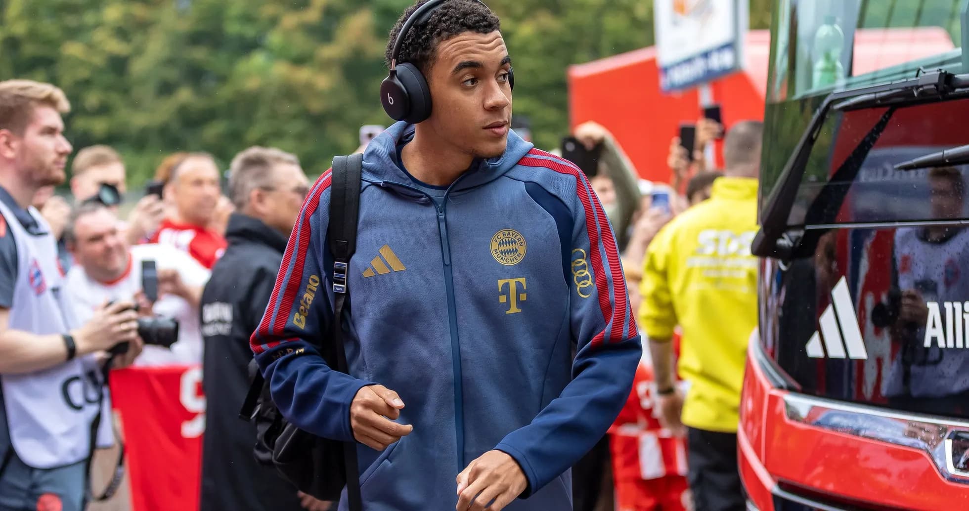 Player arriving at stadium with headphones on Player arriving at stadium with headphones on