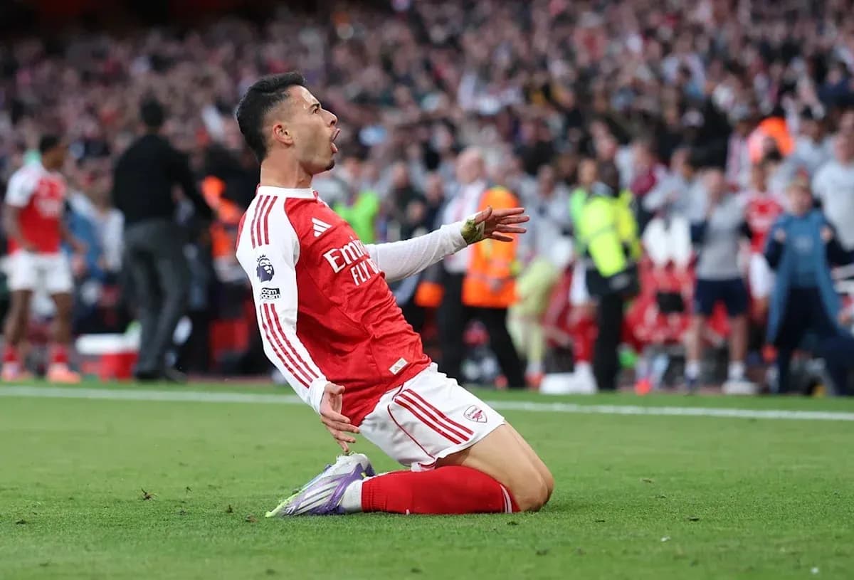 Arsenal player celebrating after scoring a goal Arsenal player celebrating after scoring a goal