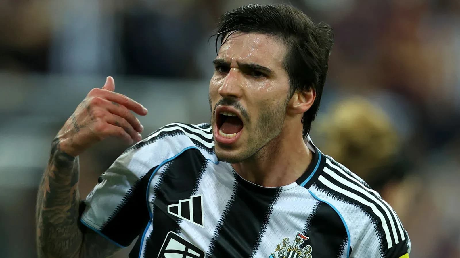 Player celebrating passionately in Newcastle jersey Player celebrating passionately in Newcastle jersey