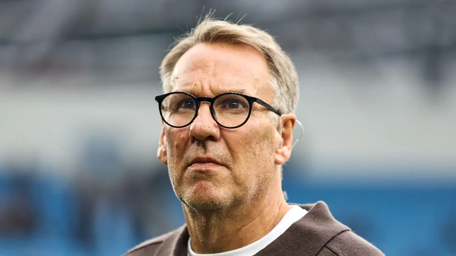 Man with glasses looking intently on the field Man with glasses looking intently on the field