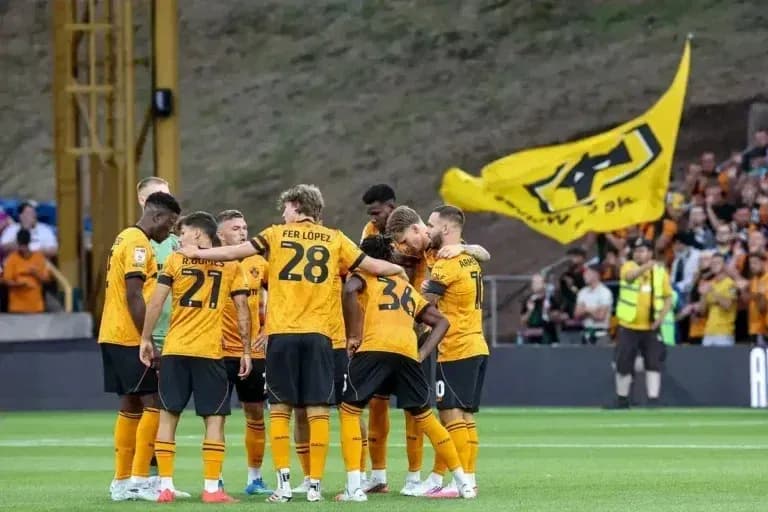 Wolverhampton Wanderers players huddled before match Wolverhampton Wanderers players huddled before match