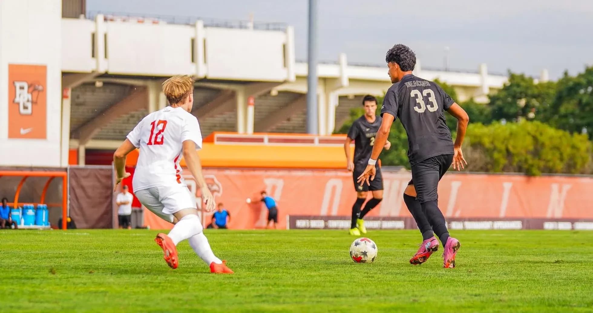 Player 12 in white chasing player 33 in black Player 12 in white chasing player 33 in black