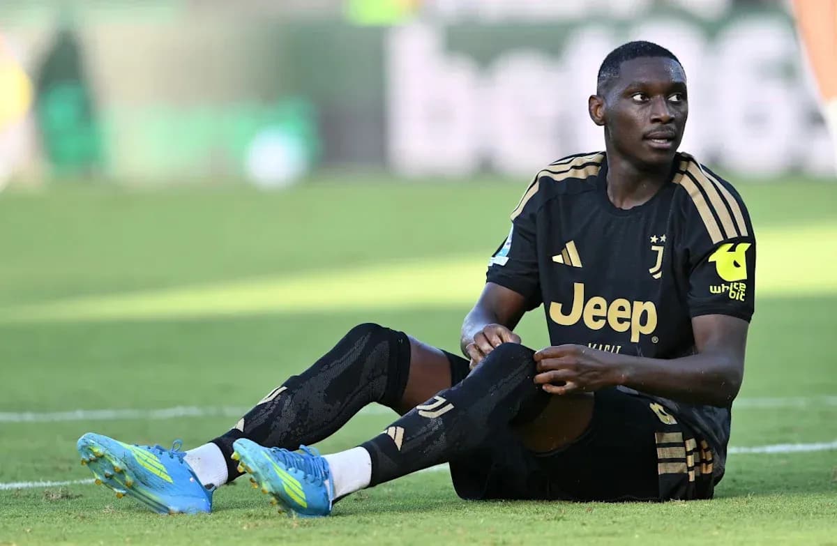 Player sitting on pitch during match recovery Player sitting on pitch during match recovery
