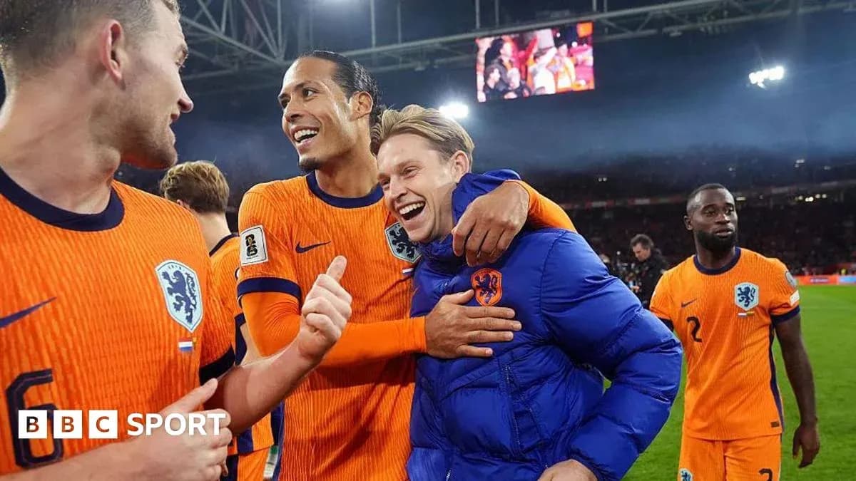 Players celebrating after a match in orange jerseys Players celebrating after a match in orange jerseys
