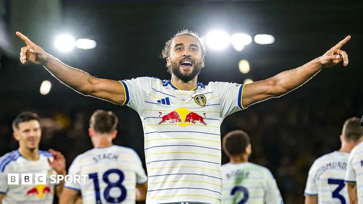 Player celebrating with teammates after scoring a goal Player celebrating with teammates after scoring a goal
