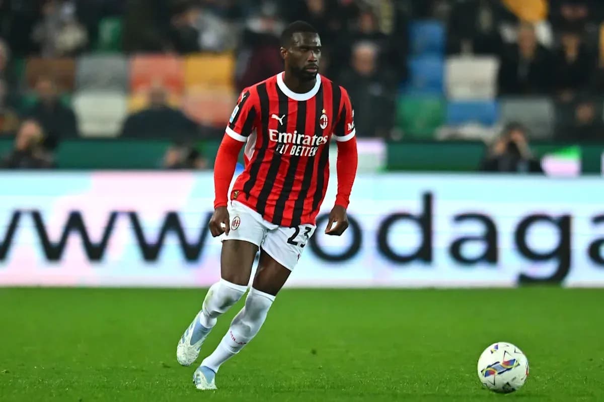 AC Milan player dribbling ball during match AC Milan player dribbling ball during match