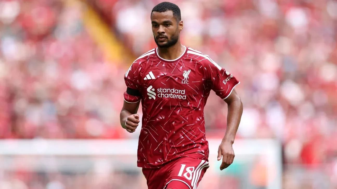 Player wearing Liverpool kit during match at stadium Player wearing Liverpool kit during match at stadium