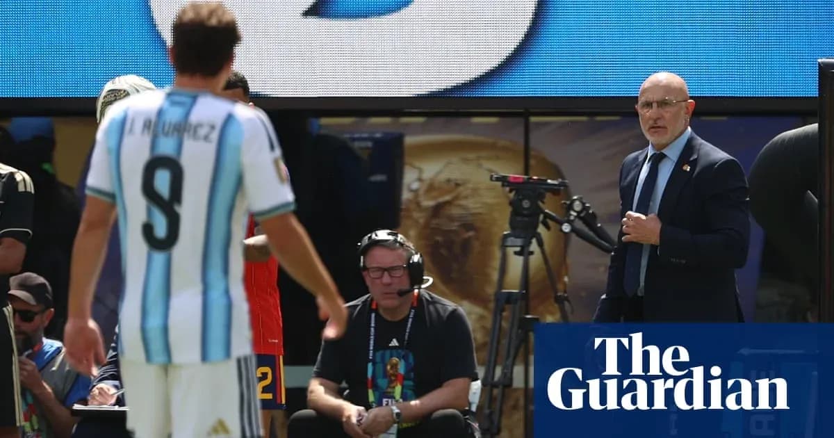 Argentinian player leaving field, coach observing closely Argentinian player leaving field, coach observing closely