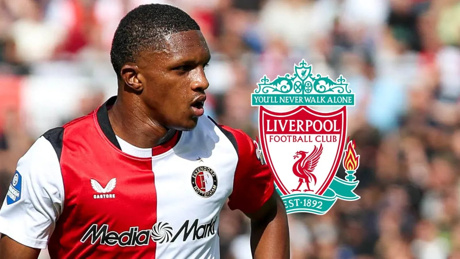 Feyenoord player in action with Liverpool logo Feyenoord player in action with Liverpool logo