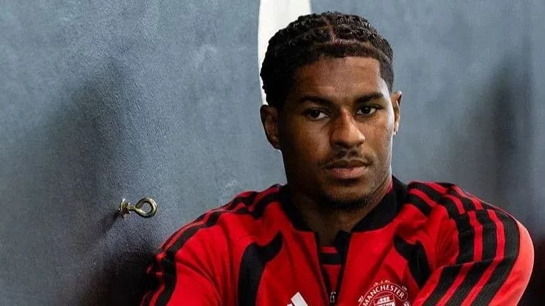 Player sitting against wall in training gear Player sitting against wall in training gear