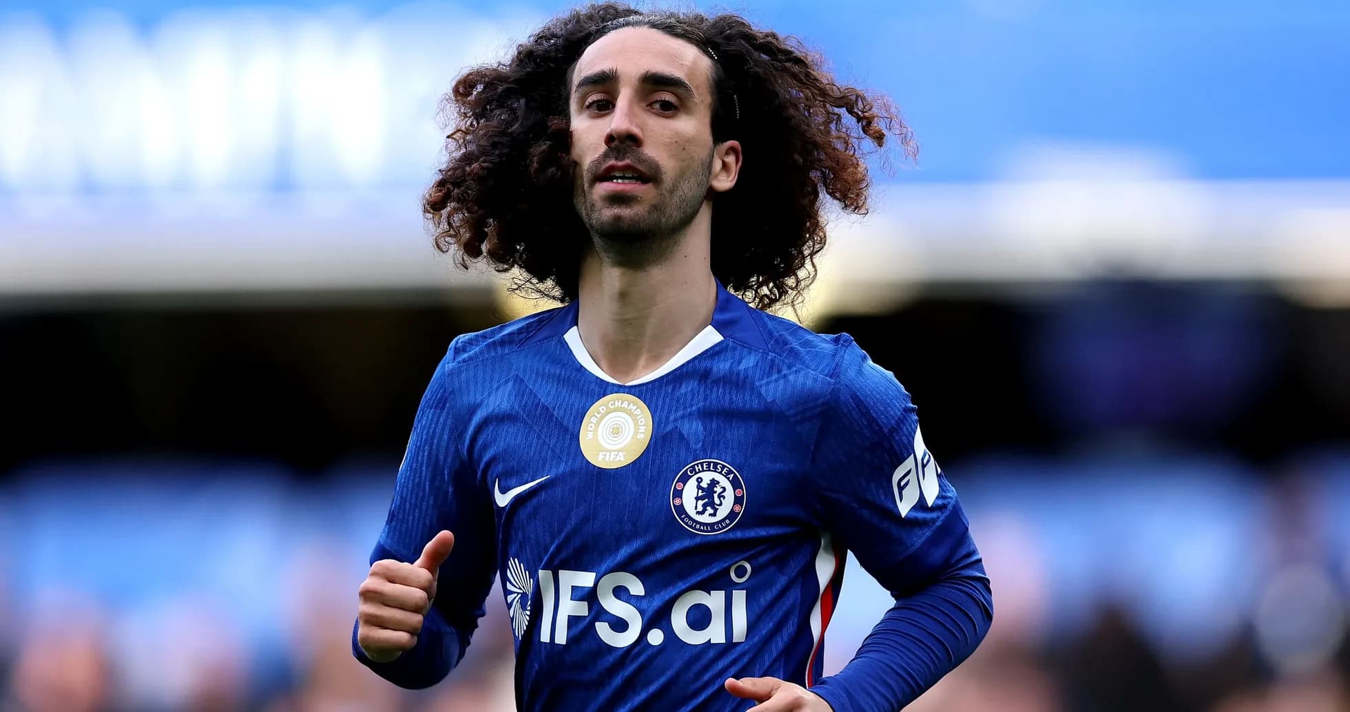 Player running on the pitch wearing Chelsea jersey Player running on the pitch wearing Chelsea jersey