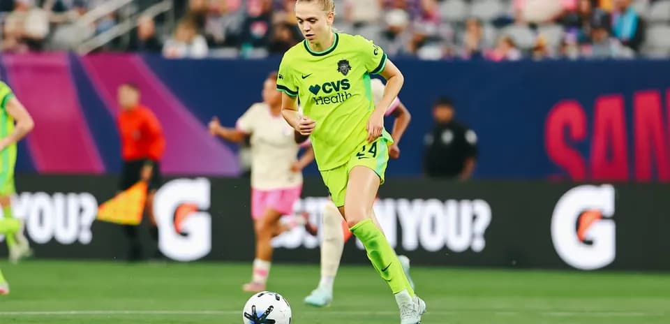 Player dribbling the ball during NWSL match Player dribbling the ball during NWSL match