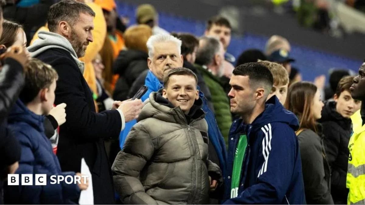 Fans interacting in stadium crowd after match Fans interacting in stadium crowd after match