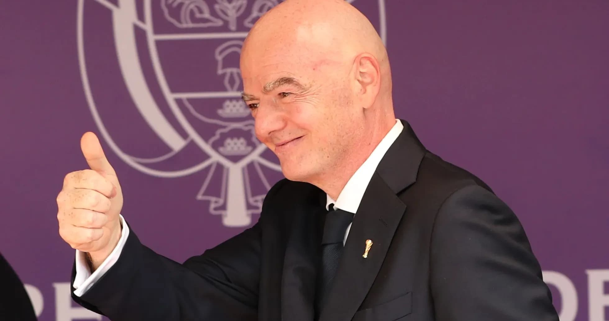 Man giving a thumbs up at an event Man giving a thumbs up at an event