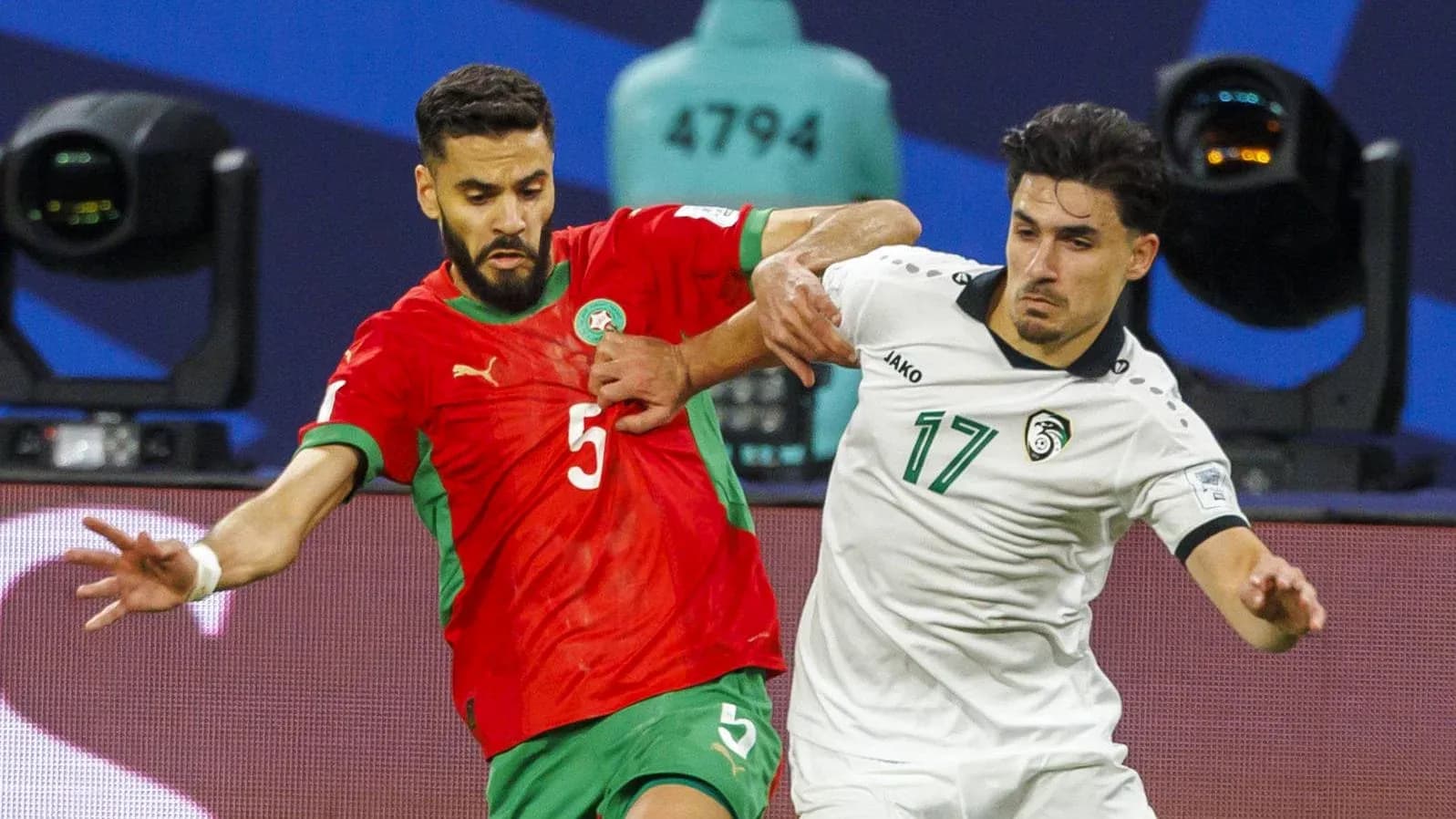 Moroccan player defending against opponent during match Moroccan player defending against opponent during match