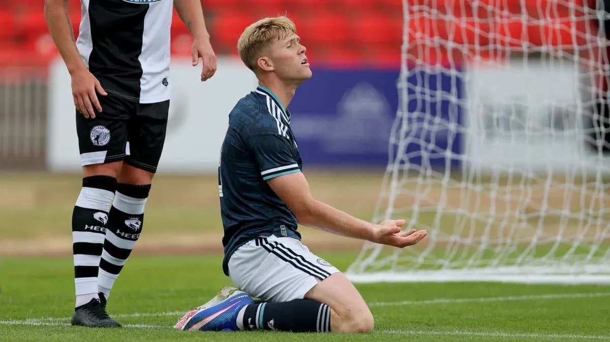 Player kneeling in front of goal during match Player kneeling in front of goal during match