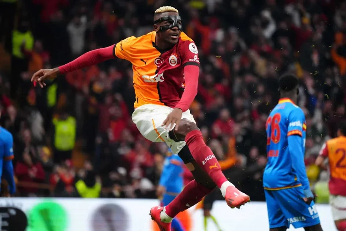 Player celebrating a goal wearing a protective mask Player celebrating a goal wearing a protective mask