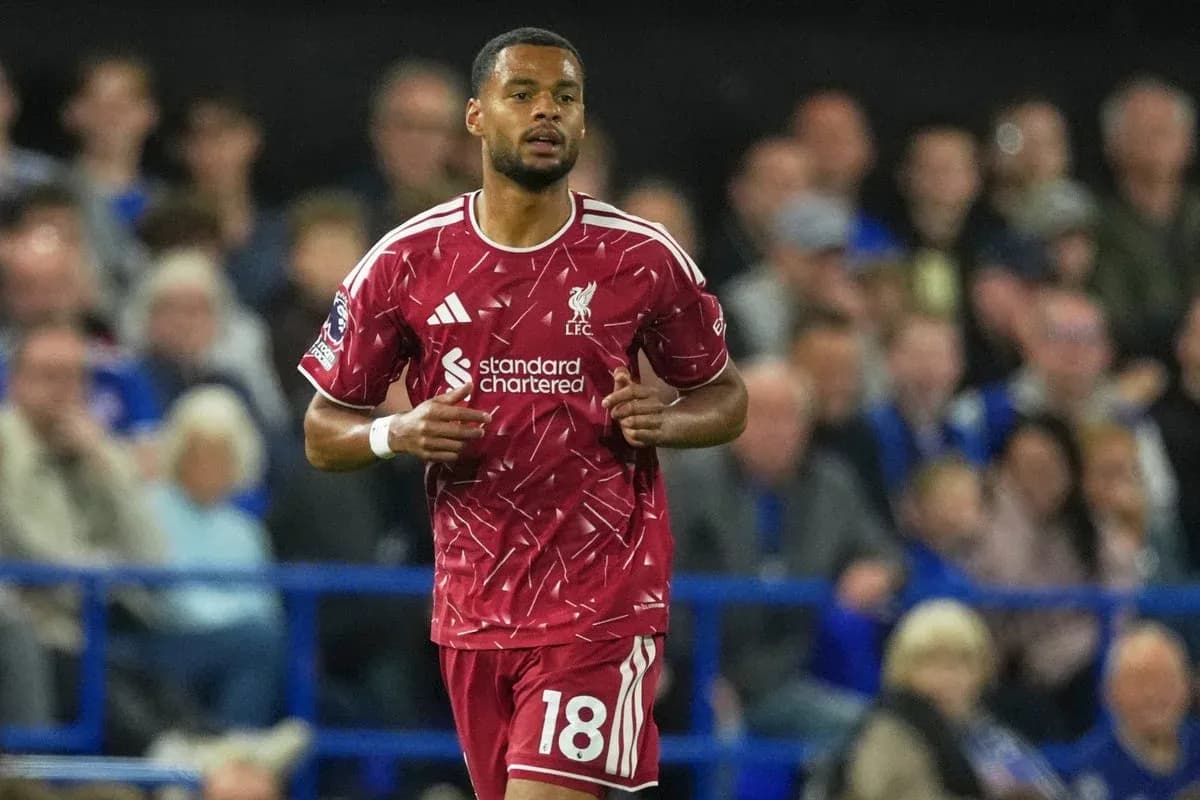 Liverpool player running on pitch during match Liverpool player running on pitch during match
