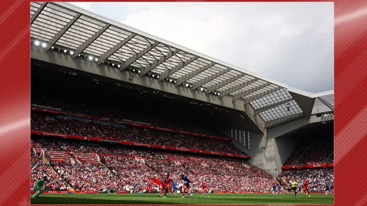 Crowd watching match at Anfield stadium Crowd watching match at Anfield stadium
