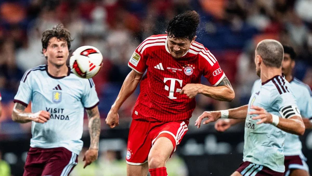 Player heading the ball during a match Player heading the ball during a match