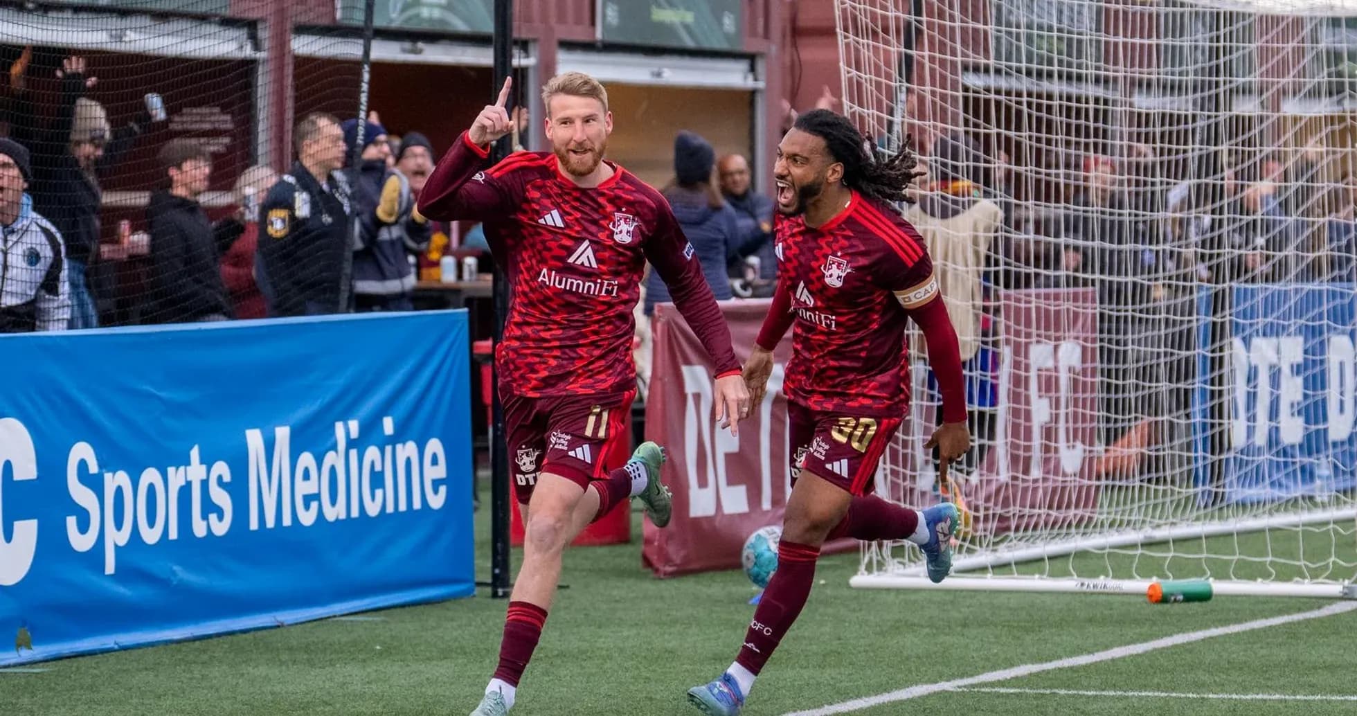 Players celebrating a goal during match Players celebrating a goal during match