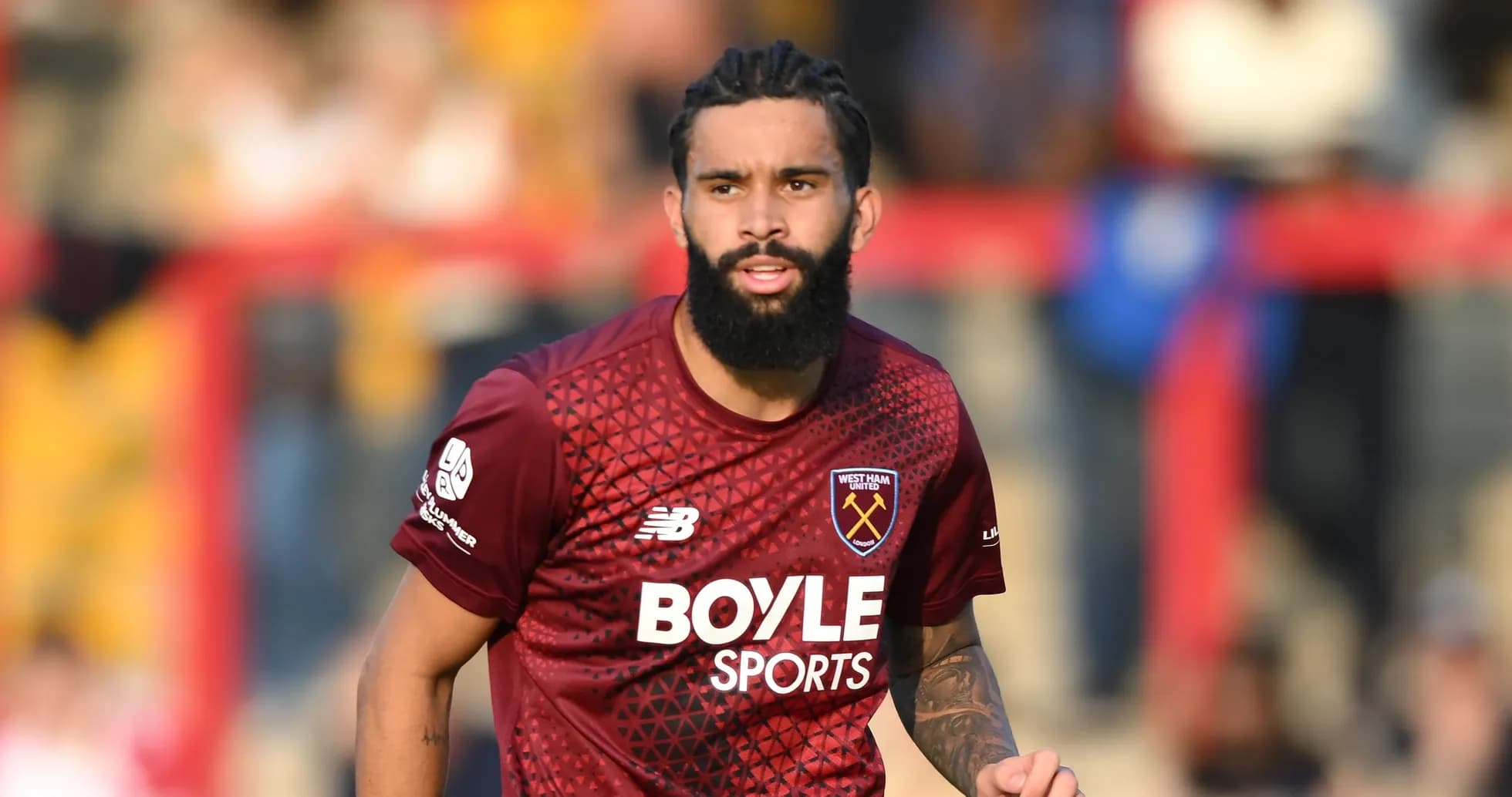 West Ham United player running on the field West Ham United player running on the field