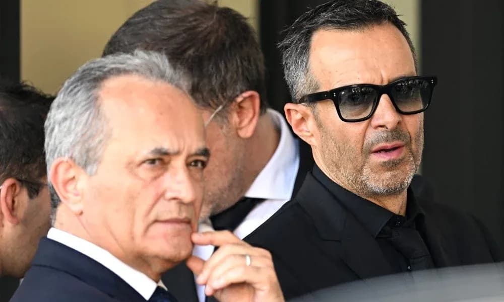 Two men in suits with sunglasses outdoors Two men in suits with sunglasses outdoors