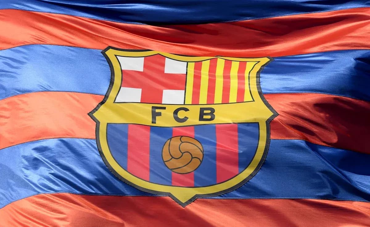 FC Barcelona logo on striped flag background FC Barcelona logo on striped flag background