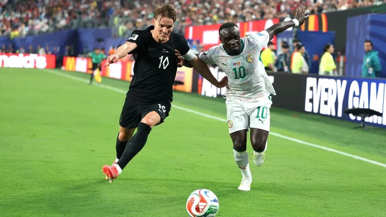 Two players competing for the ball on field Two players competing for the ball on field