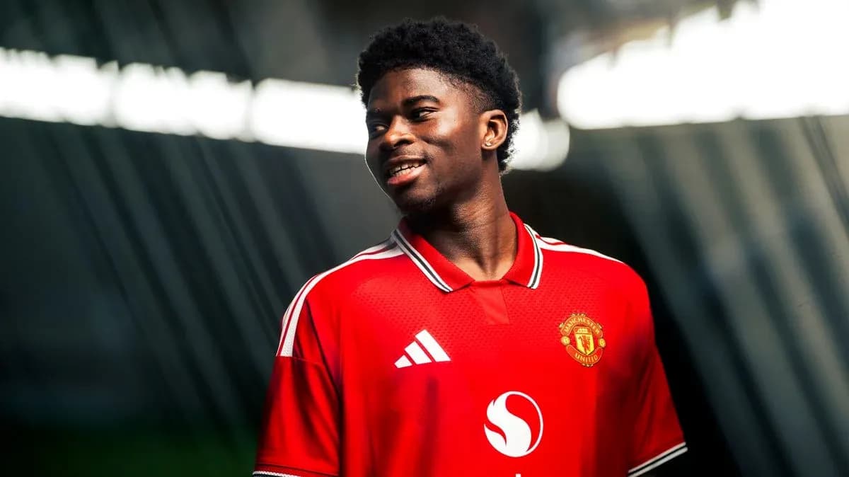 Player wearing Manchester United jersey smiling Player wearing Manchester United jersey smiling