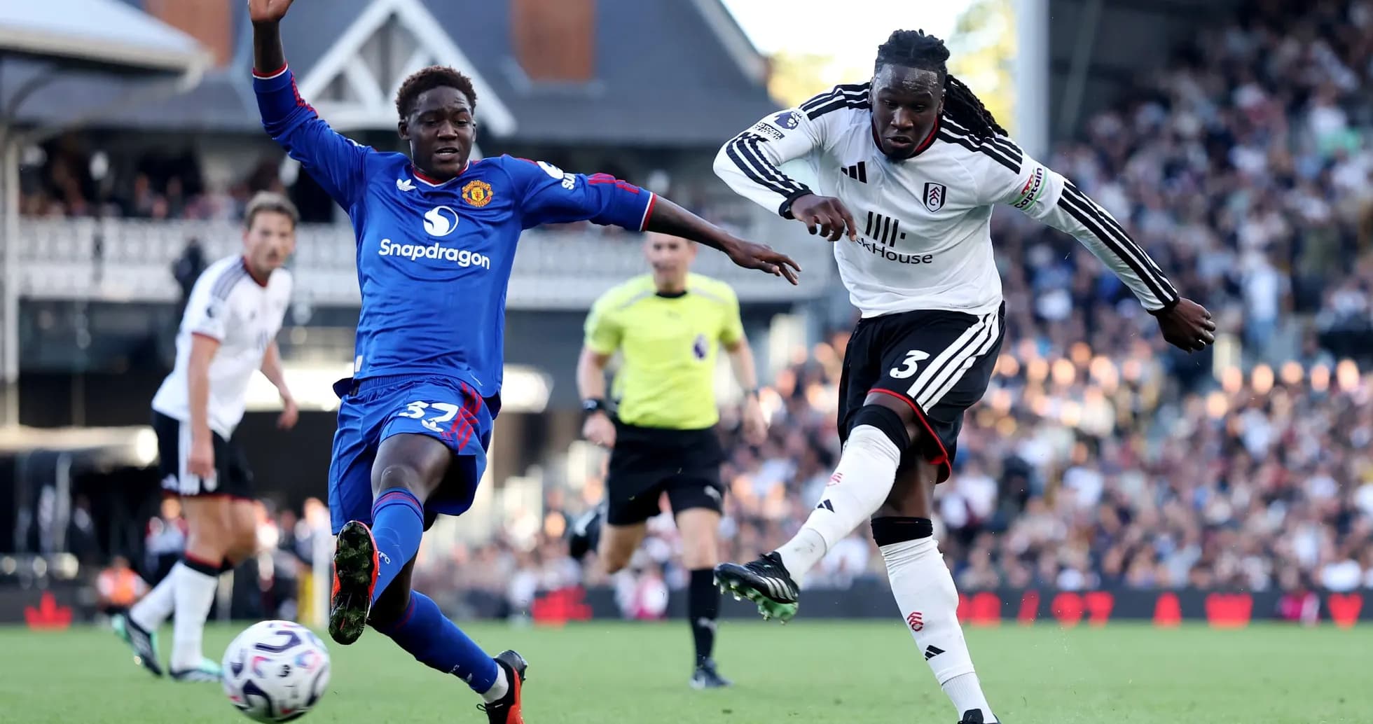 Fulham and Manchester United players competing for the ball Fulham and Manchester United players competing for the ball