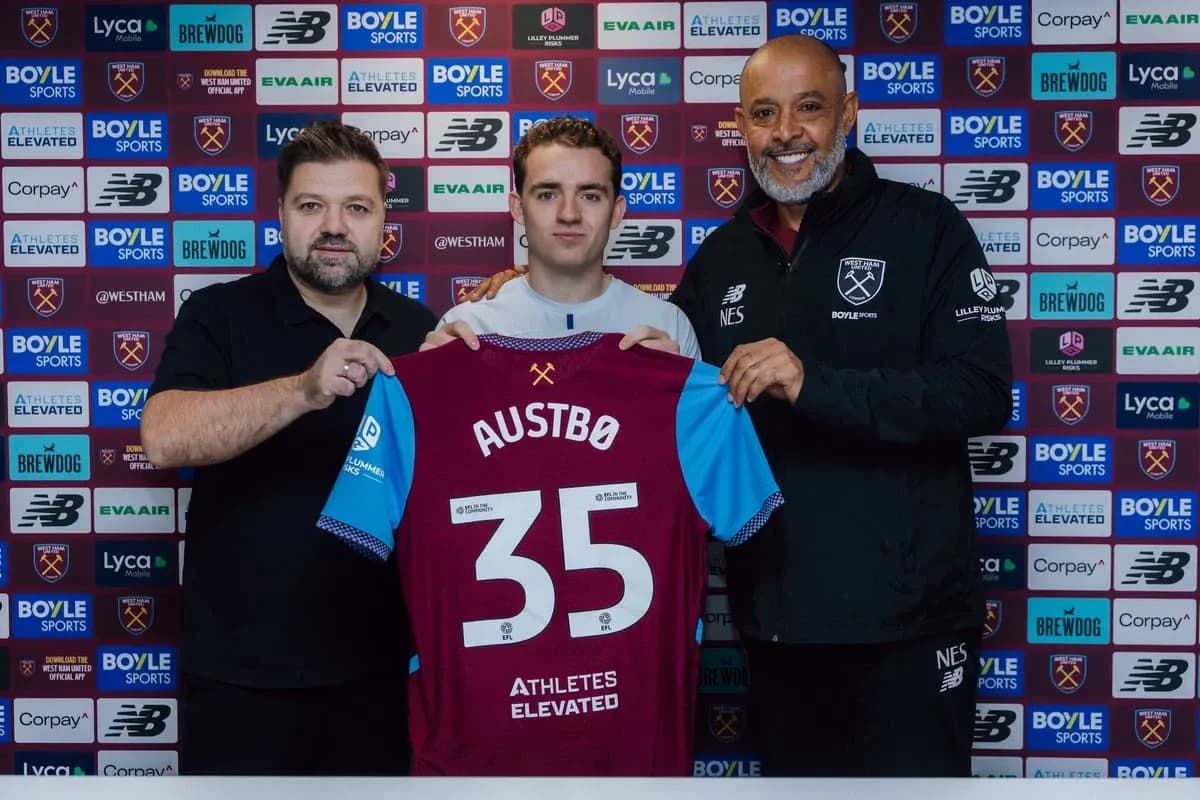 Player holding jersey during club signing announcement Player holding jersey during club signing announcement