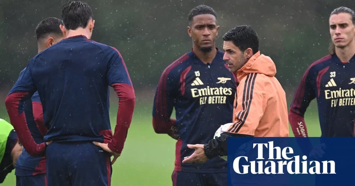 Manager discussing tactics with players during training Manager discussing tactics with players during training