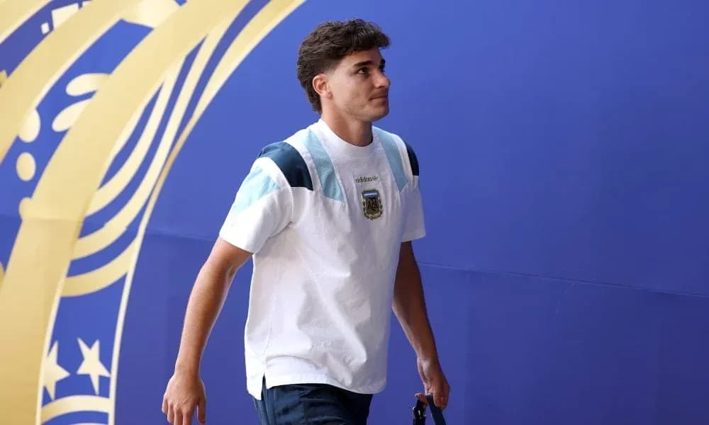 Player walking through entrance with team jersey Player walking through entrance with team jersey