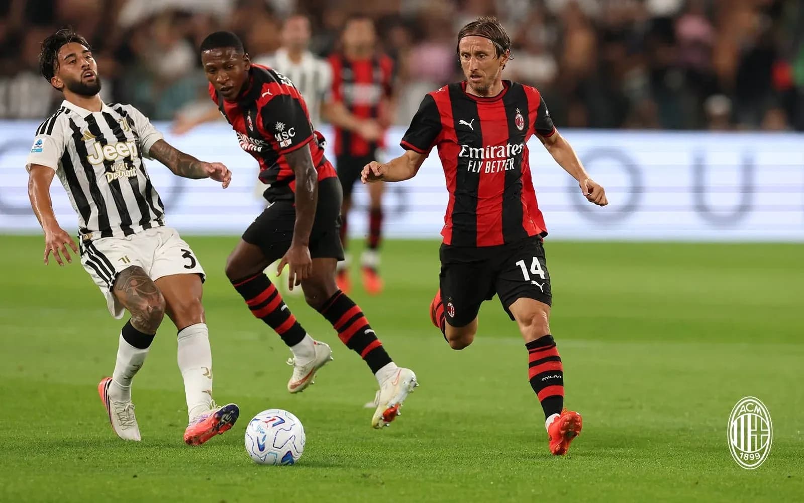 Juventus and AC Milan players in action Juventus and AC Milan players in action