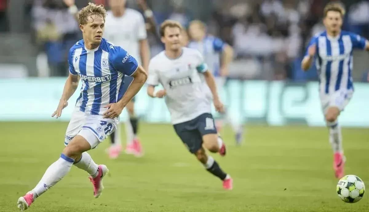 Lech Poznan player dribbling past opponents Lech Poznan player dribbling past opponents