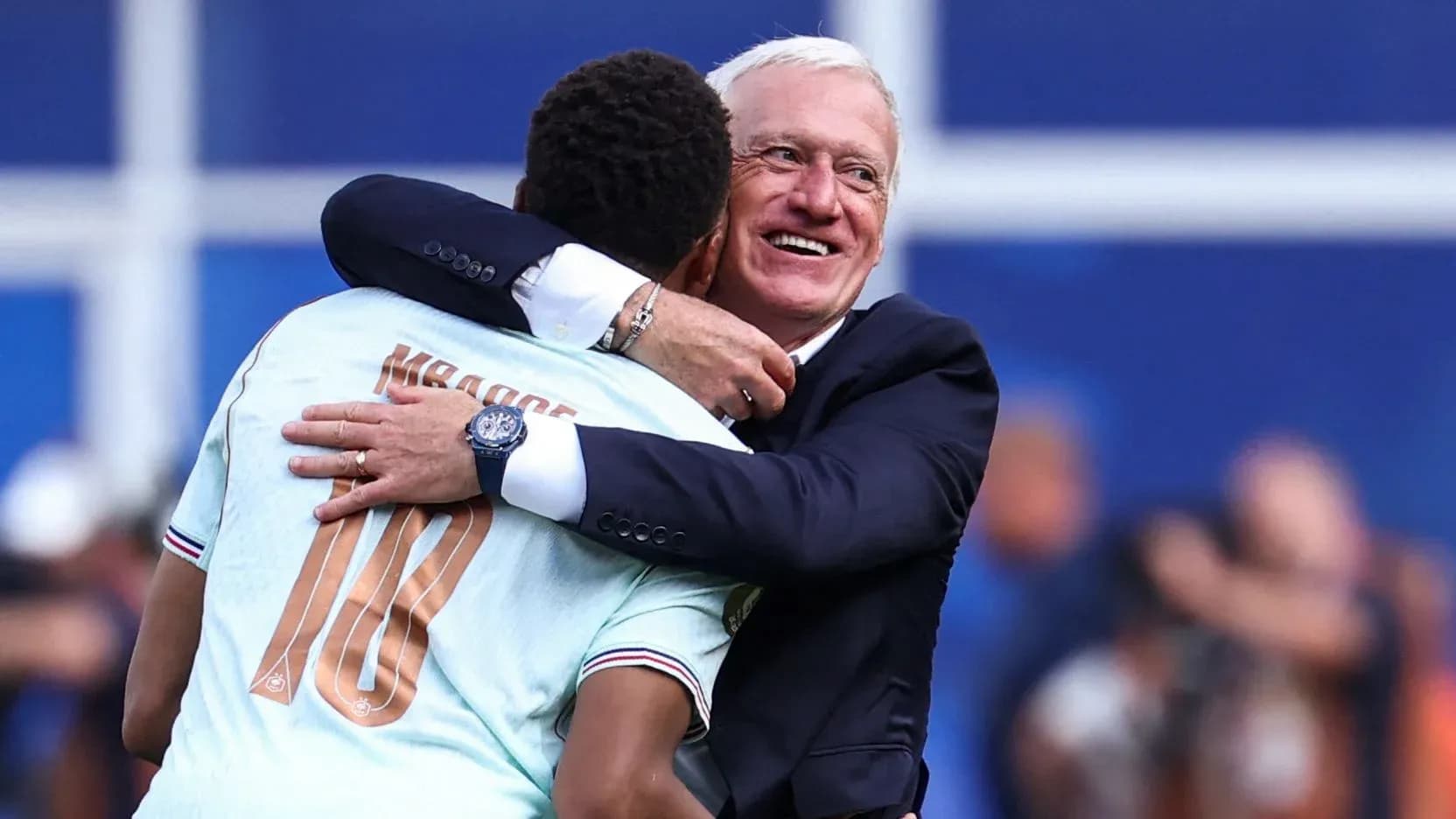 Player and coach embracing after a match Player and coach embracing after a match