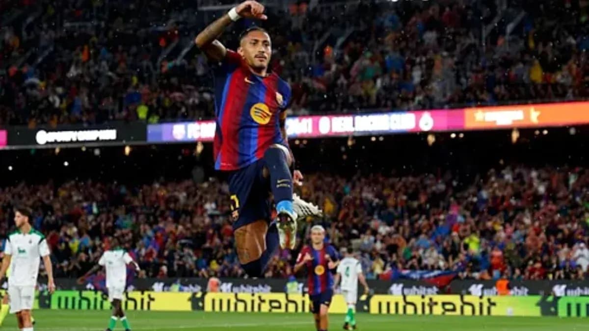 Player celebrating a goal at FC Barcelona match Player celebrating a goal at FC Barcelona match