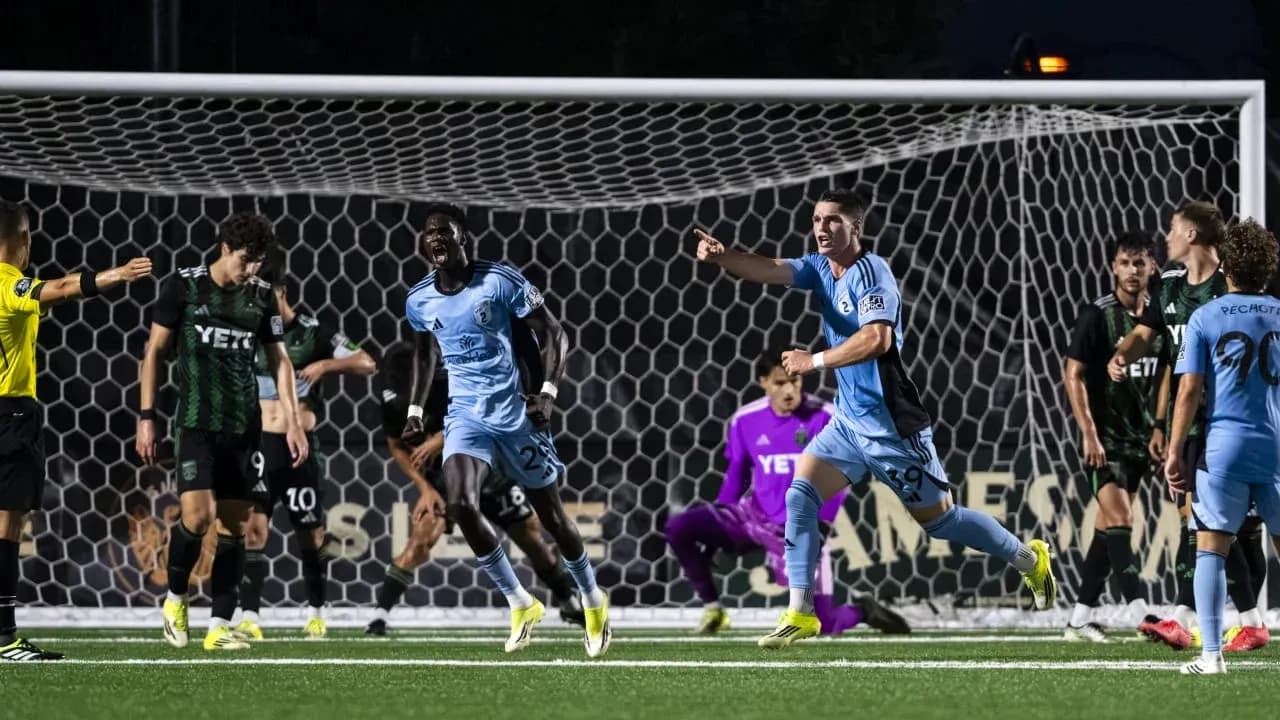 Players celebrating a goal during match Players celebrating a goal during match
