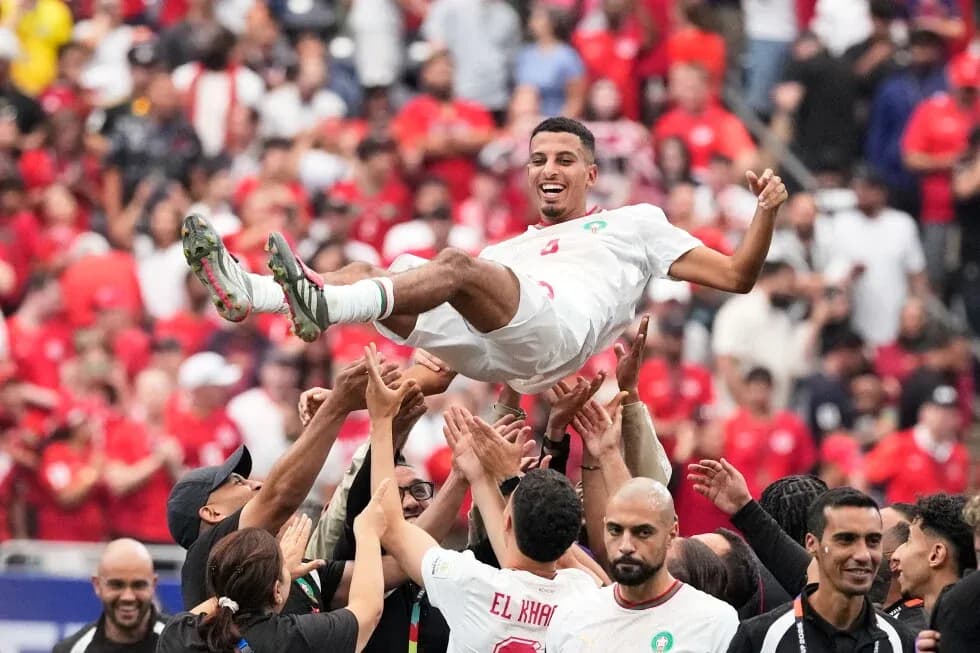 Player being celebrated by teammates after victory Player being celebrated by teammates after victory