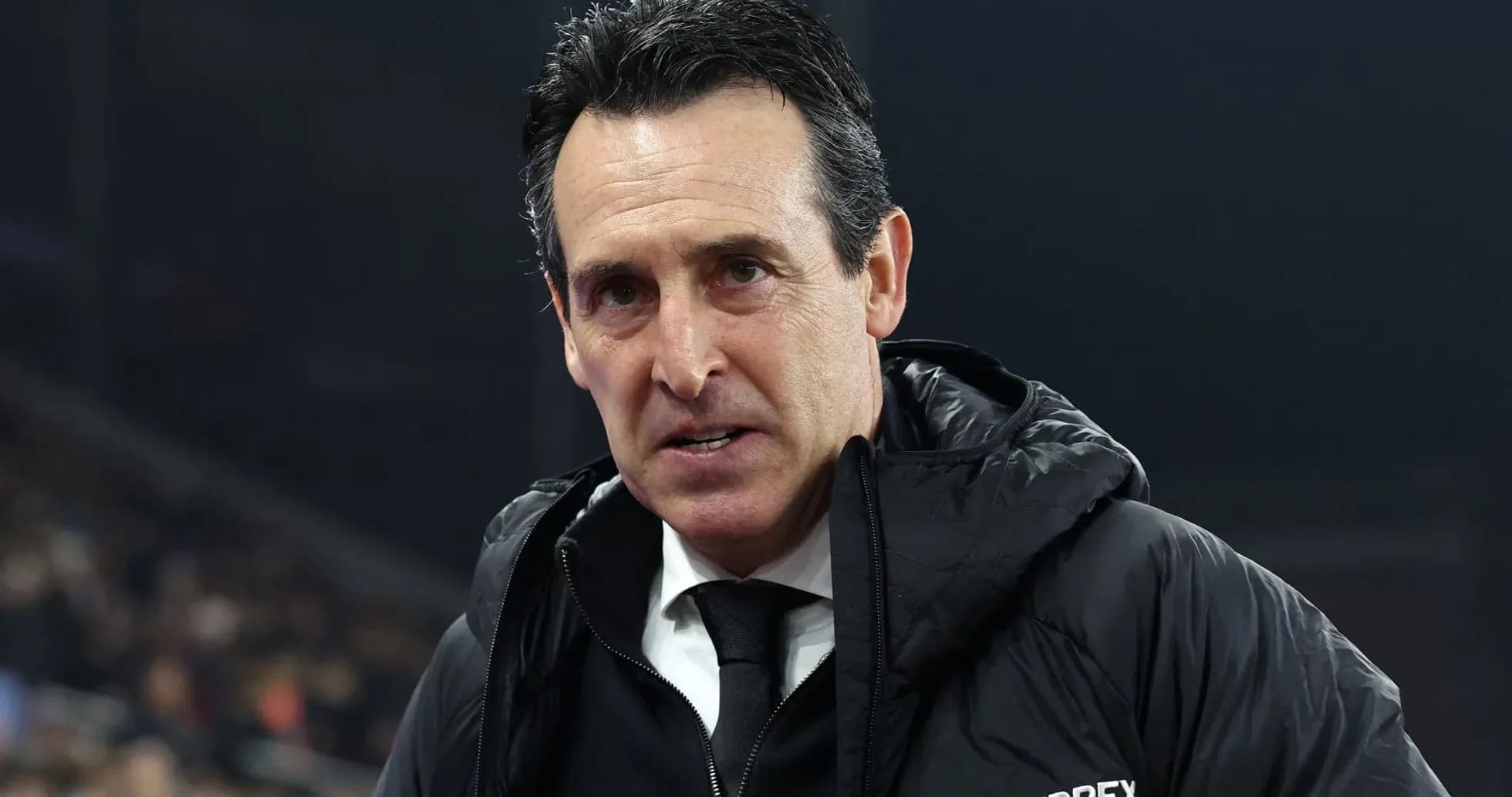 Coach in a black jacket during match Coach in a black jacket during match