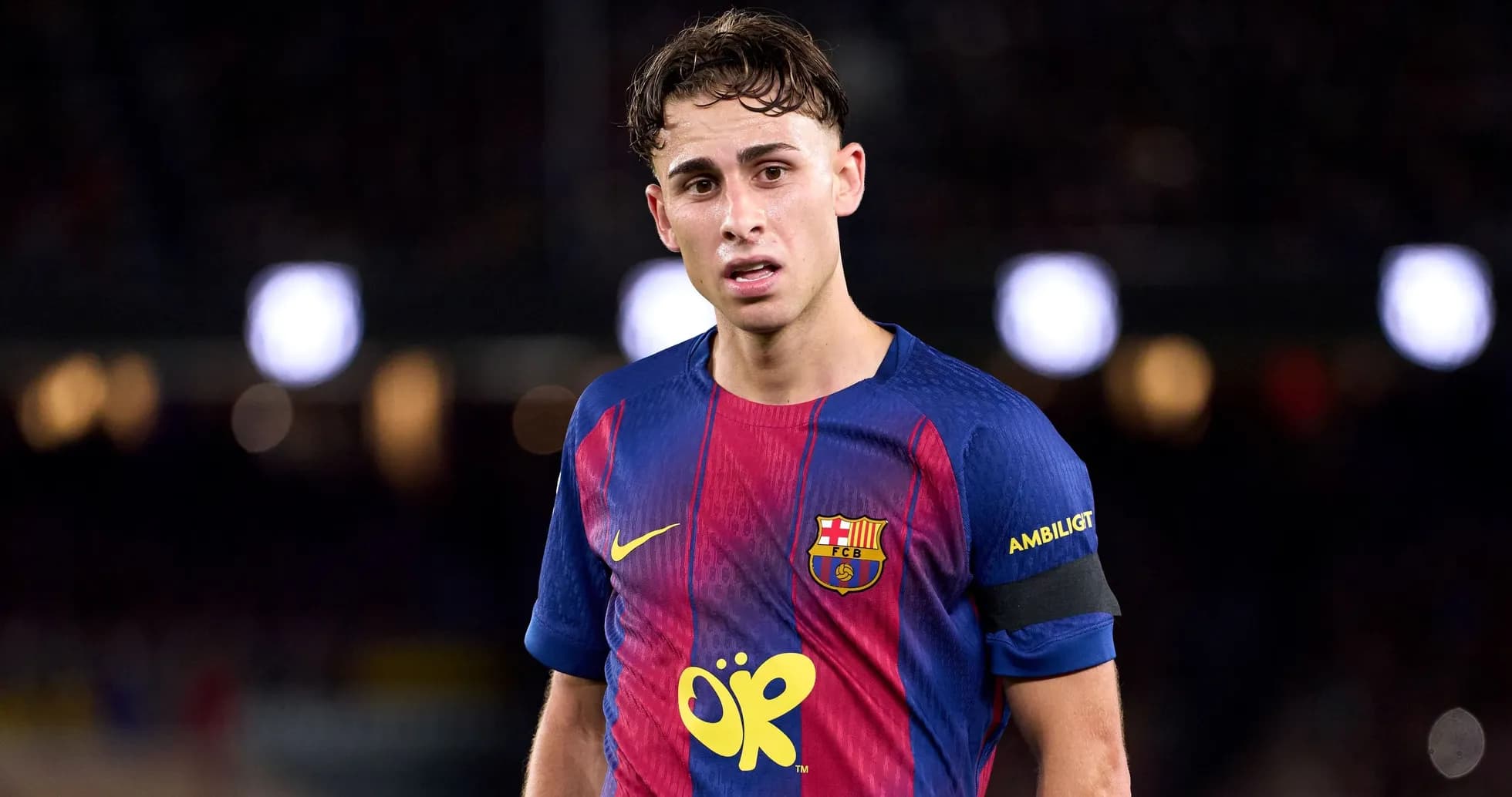 Player wearing FC Barcelona jersey on the pitch Player wearing FC Barcelona jersey on the pitch
