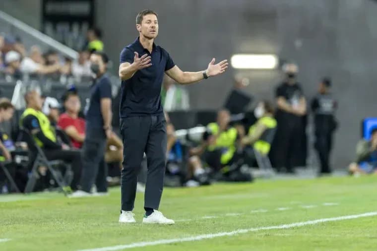 Coach gesturing during a soccer match on the sideline Coach gesturing during a soccer match on the sideline