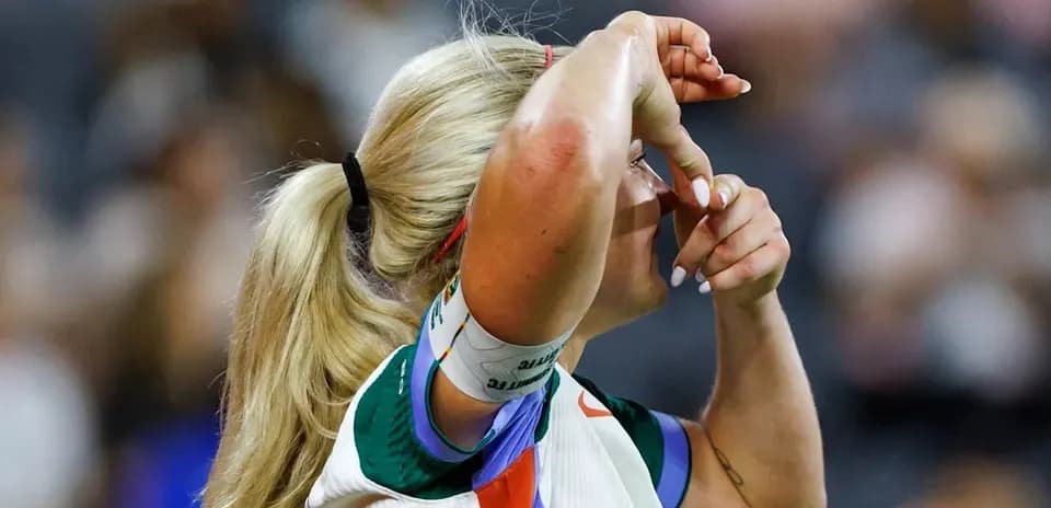 Athlete adjusting headband during sports event Athlete adjusting headband during sports event
