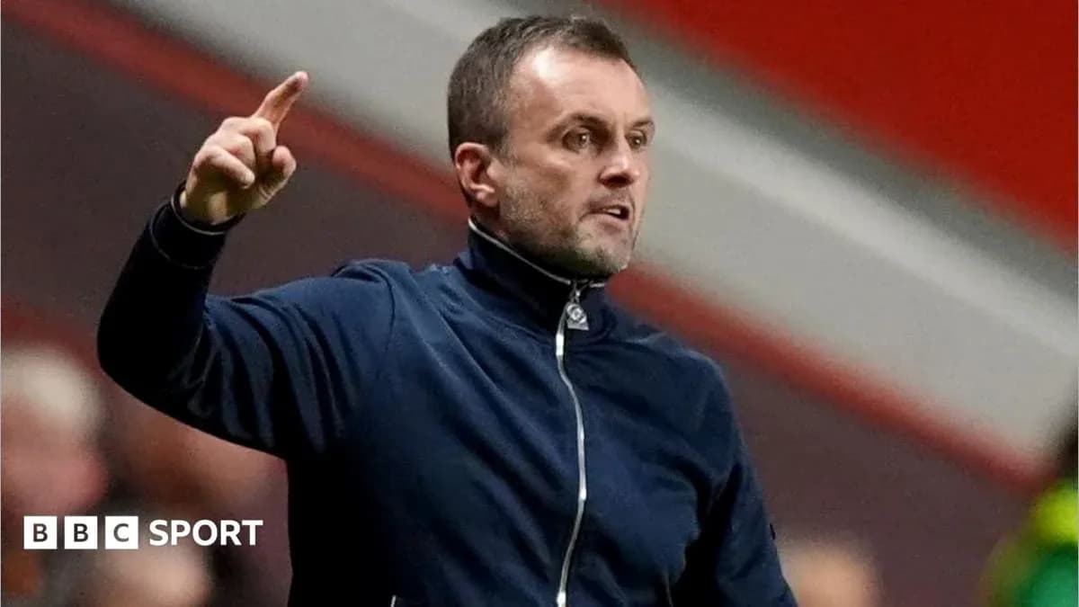 Manager gesturing during a football match Manager gesturing during a football match