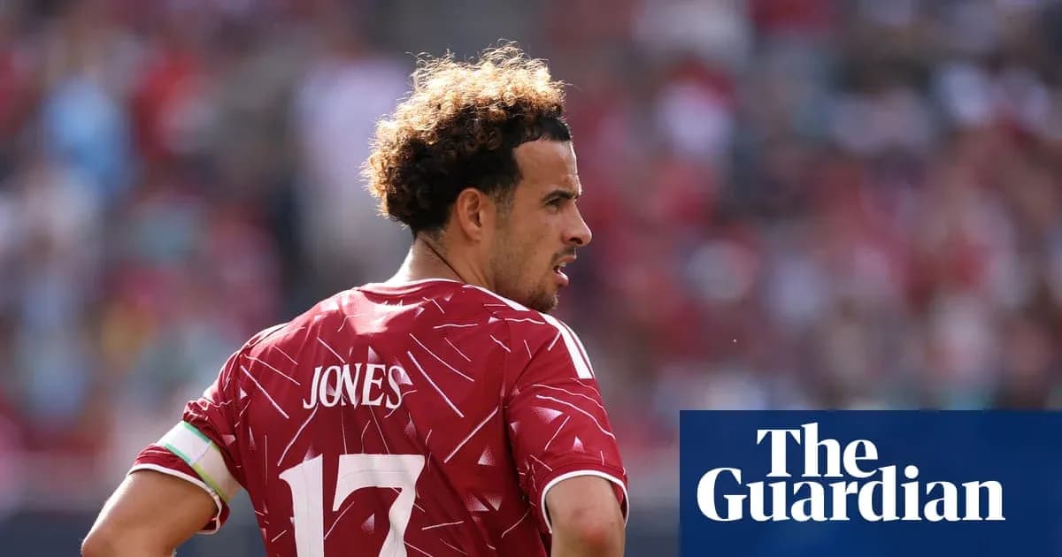 Player in red jersey with 'Jones' on back Player in red jersey with 'Jones' on back