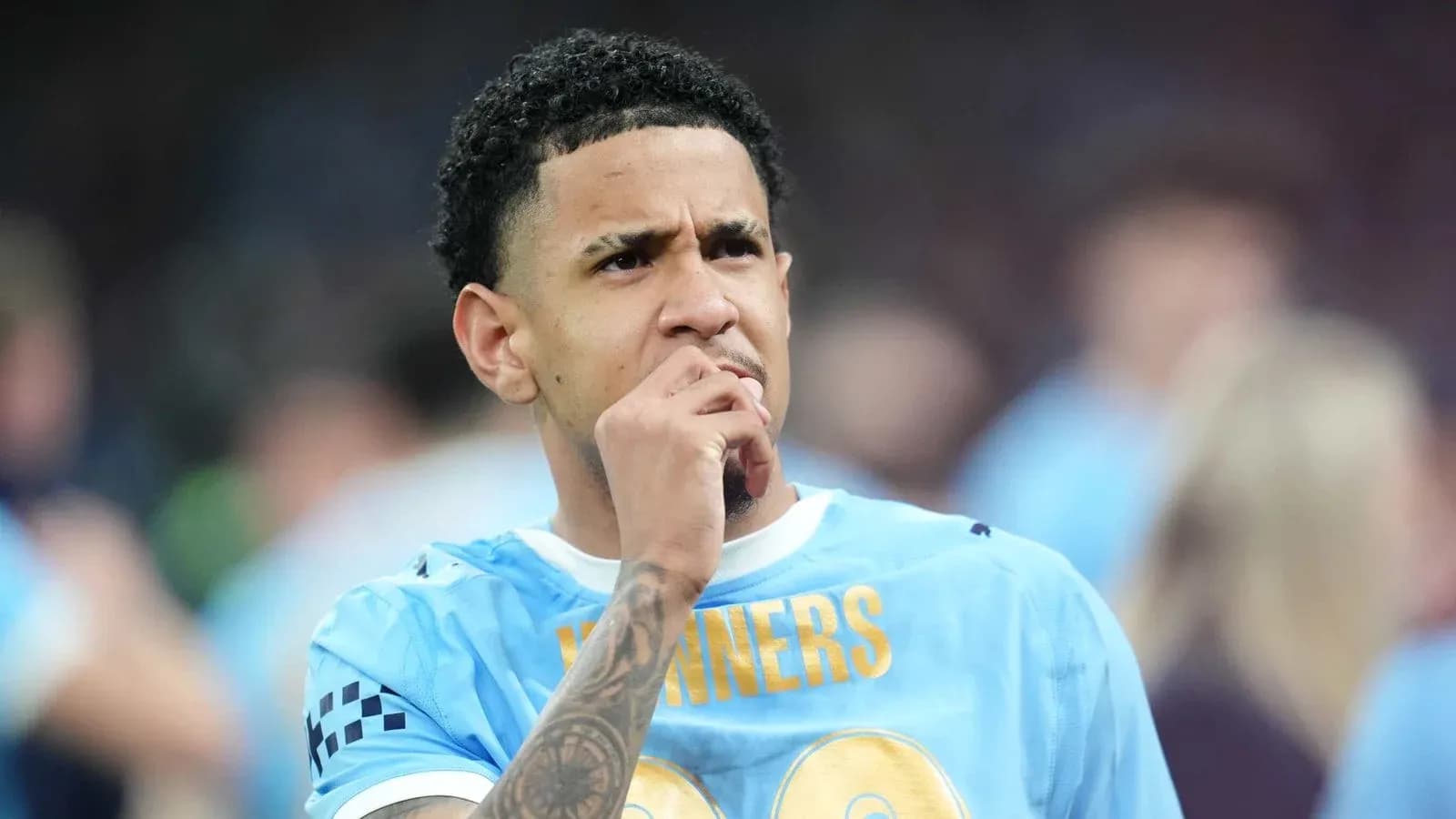 Player contemplating during a match in blue jersey Player contemplating during a match in blue jersey