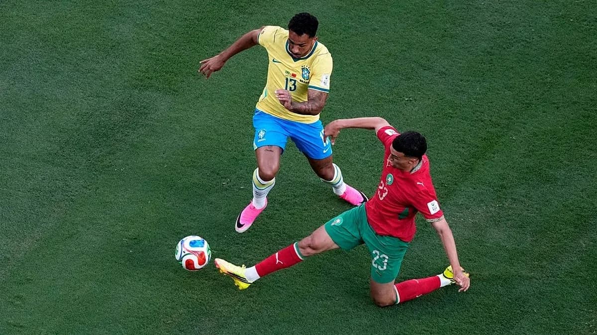 Brazil player challenging Morocco player for the ball Brazil player challenging Morocco player for the ball
